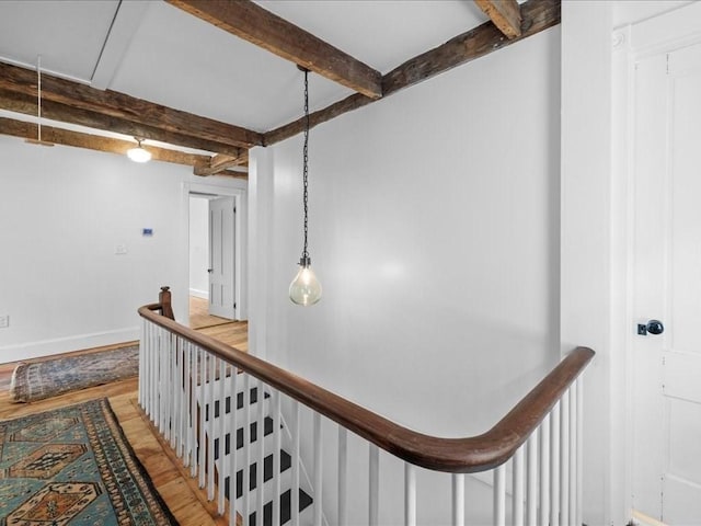 131 Cedar St, Middleboro, MA 02346 - hallway featuring attic access, an upstairs landing, beam ceiling, light wood finished floors, and baseboards