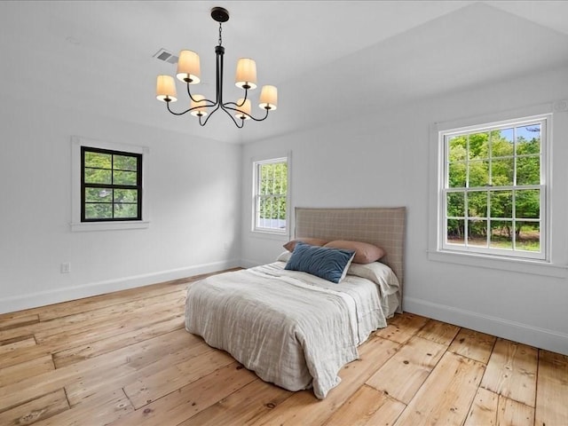 131 Cedar St, Middleboro, MA 02346 - bedroom featuring a chandelier, wood-type flooring, and baseboards