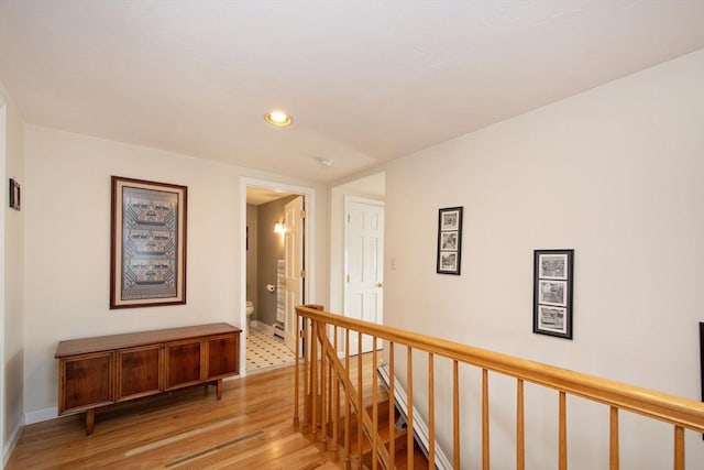 25 11th Rd, Marshfield, MA 02050 - corridor with an upstairs landing, light wood-style floors, recessed lighting, and baseboards