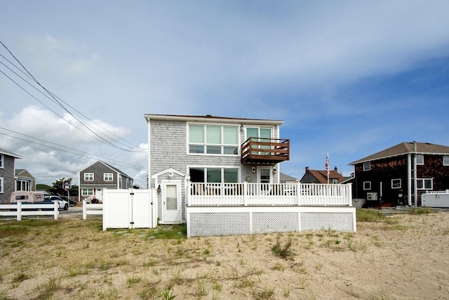 25 11th Rd, Marshfield, MA 02050 - back of property with a wooden deck, a balcony, and a gate