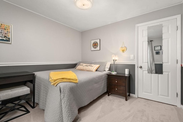 bedroom featuring baseboards and carpet