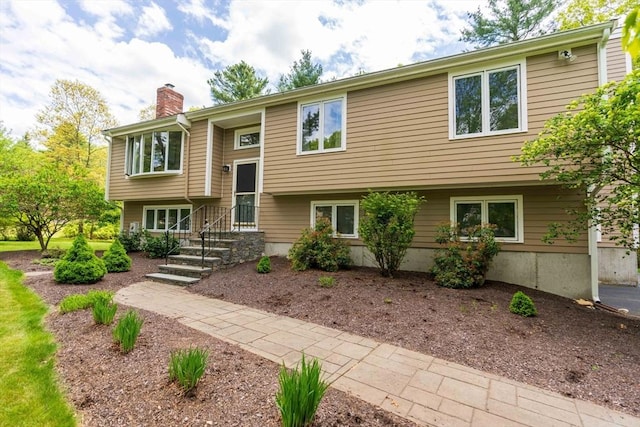 split foyer home with a chimney