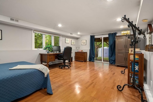 bedroom with light wood finished floors, access to exterior, recessed lighting, and a desk