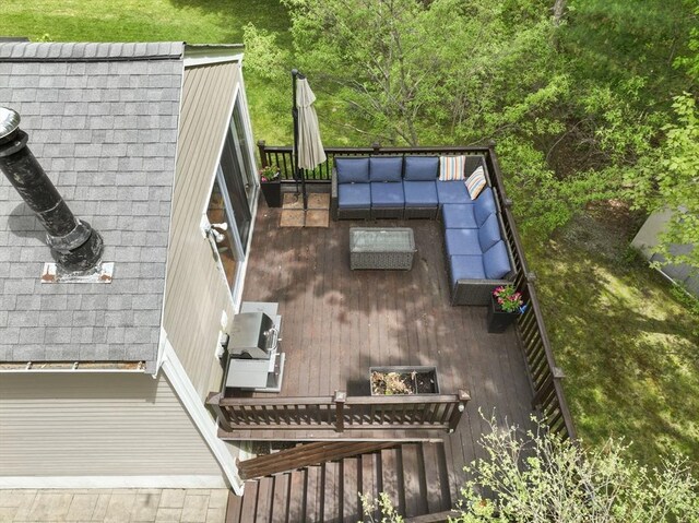 wooden deck featuring an outdoor living space