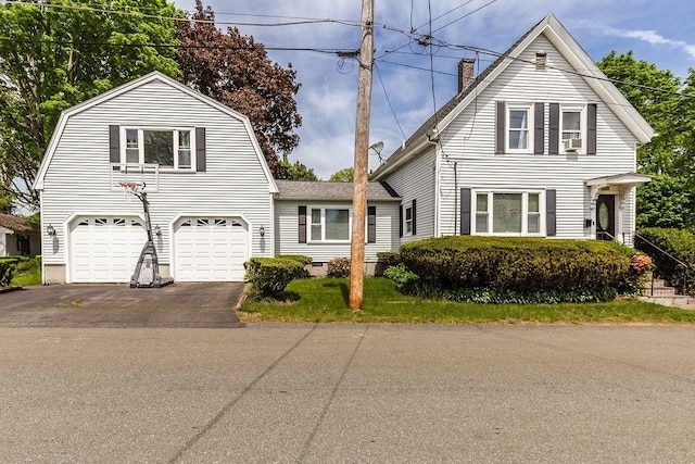 135 Hammond St, Brockton, MA 02302 - colonial inspired home with asphalt driveway, a chimney, a garage, and a gambrel roof