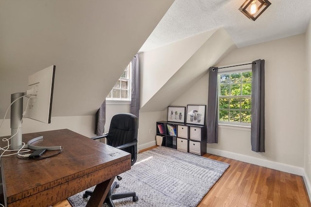 38 Fairmount Rd, Reading, MA 01867 - office area featuring wood finished floors, lofted ceiling, and a textured ceiling