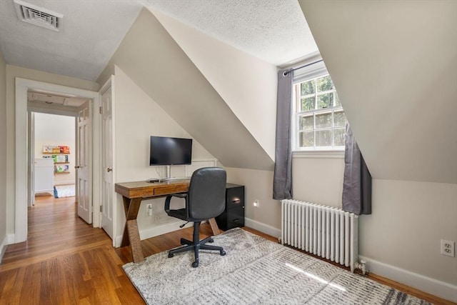 38 Fairmount Rd, Reading, MA 01867 - office with radiator, wood finished floors, a textured ceiling, and lofted ceiling
