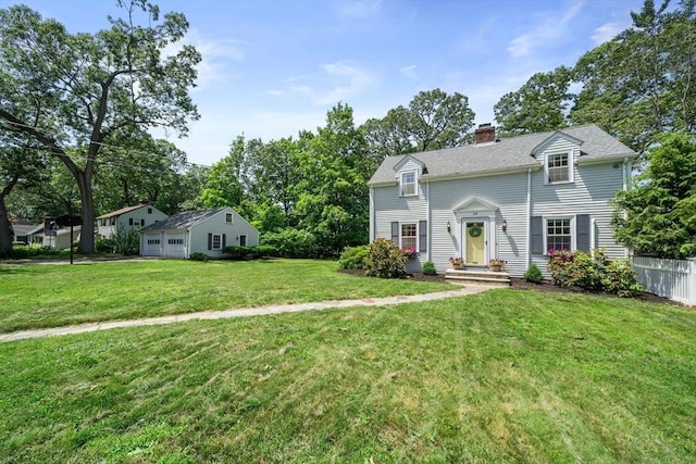 38 Fairmount Rd, Reading, MA 01867 - view of front of home featuring a chimney and a detached garage