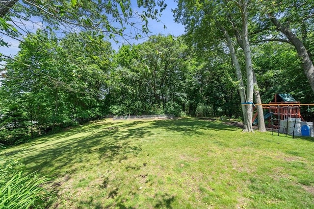 38 Fairmount Rd, Reading, MA 01867 - view of grassy yard featuring a playground