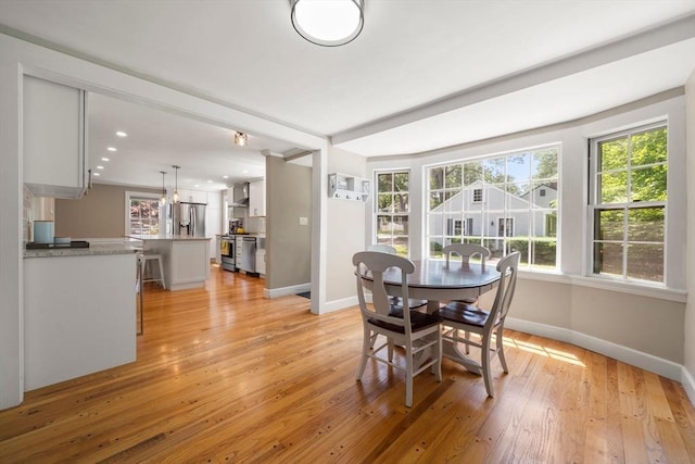 38 Fairmount Rd, Reading, MA 01867 - dining space featuring light wood finished floors, healthy amount of natural light, and recessed lighting