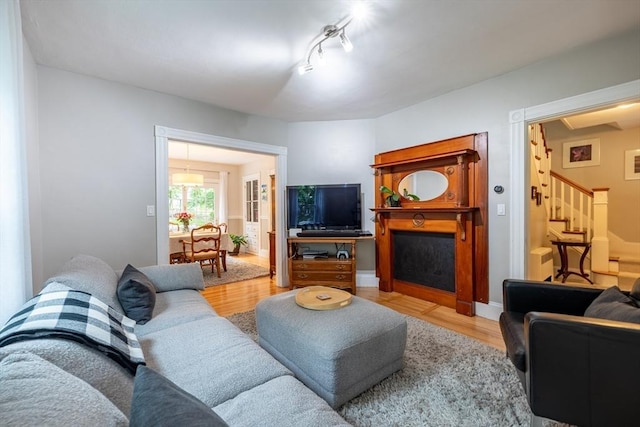 57 Clapp St, Walpole, MA 02081 - living room featuring stairway, wood finished floors, and a fireplace