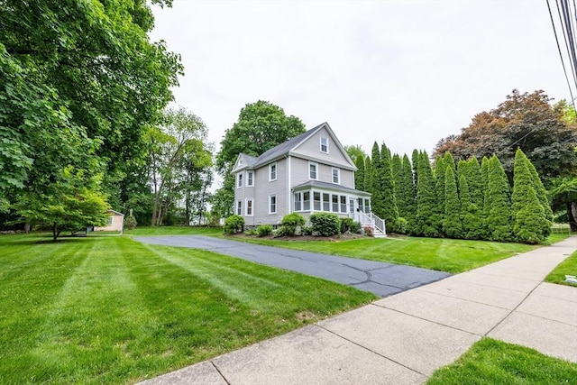 57 Clapp St, Walpole, MA 02081 - view of front of property with a front yard and asphalt driveway