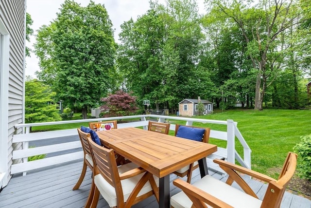 57 Clapp St, Walpole, MA 02081 - wooden terrace with outdoor dining area, a lawn, and view of wooded area