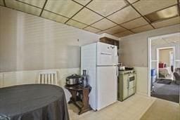 181 W St, Leominster, MA 01453 - kitchen with white fridge, stove, and radiator heating unit