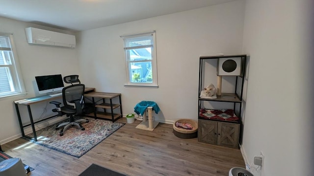 3 Bennett St, Hudson, MA 01749 - office featuring a wall unit AC, wood finished floors, and baseboards