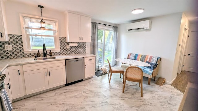 3 Bennett St, Hudson, MA 01749 - kitchen featuring stainless steel dishwasher, a wall mounted air conditioner, a sink, light marble finish floors, and backsplash