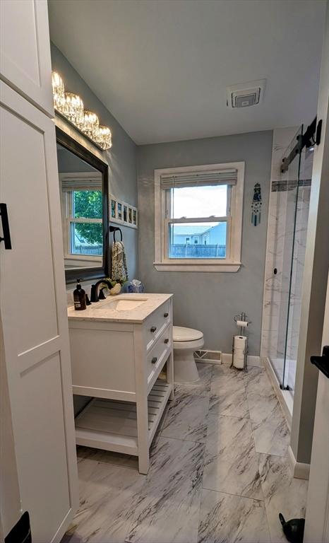 3 Bennett St, Hudson, MA 01749 - full bathroom with a shower stall, healthy amount of natural light, and toilet