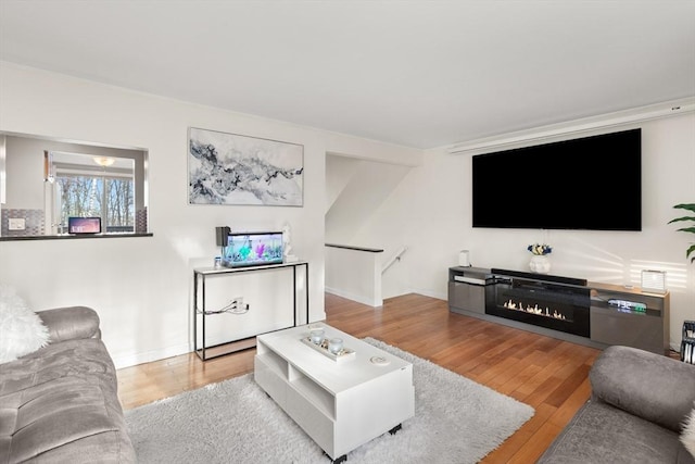 living room with light hardwood / wood-style flooring