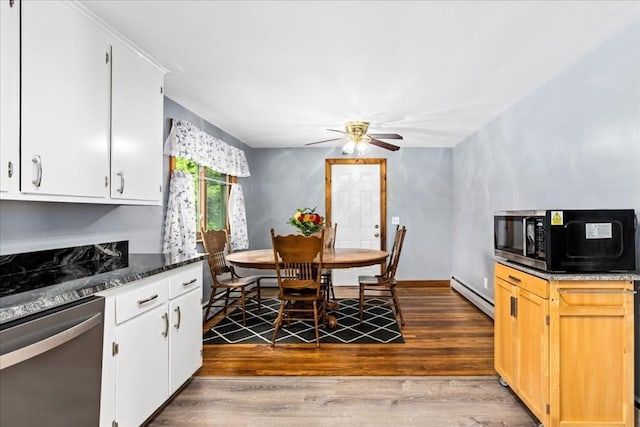 9 Lillian Rd, Acton, MA 01720 - kitchen with dishwasher, baseboard heating, wood finished floors, ceiling fan, and white cabinets