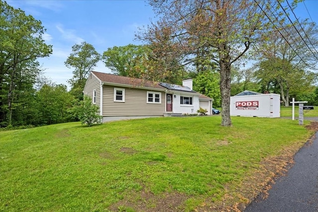 9 Lillian Rd, Acton, MA 01720 - view of front of property featuring a chimney and a front lawn
