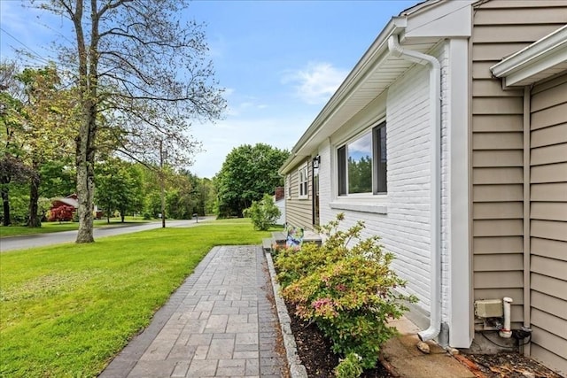 9 Lillian Rd, Acton, MA 01720 - view of side of property with a lawn