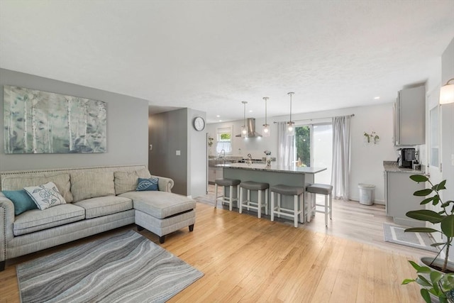 853 Sandwich, Falmouth, MA 02536 - living room with light wood-style flooring, recessed lighting, and baseboards