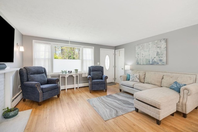 853 Sandwich, Falmouth, MA 02536 - living room with a baseboard radiator and hardwood / wood-style flooring