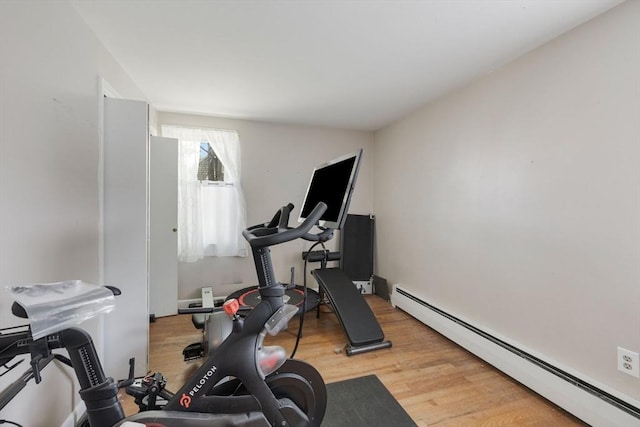 853 Sandwich, Falmouth, MA 02536 - exercise area featuring baseboard heating and wood finished floors