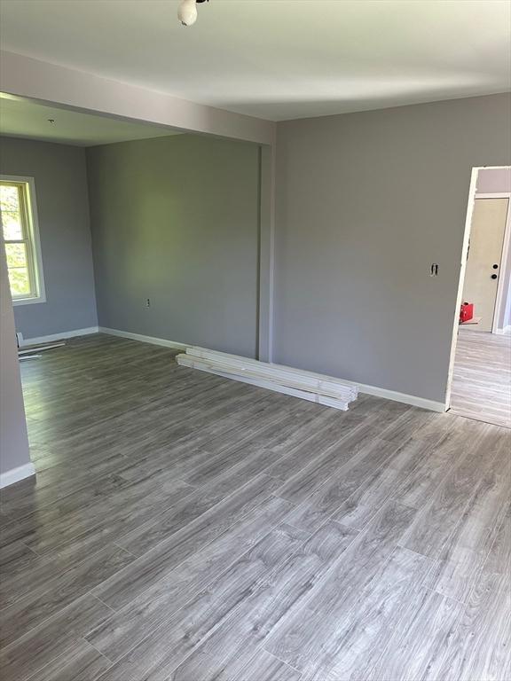 empty room featuring hardwood / wood-style flooring