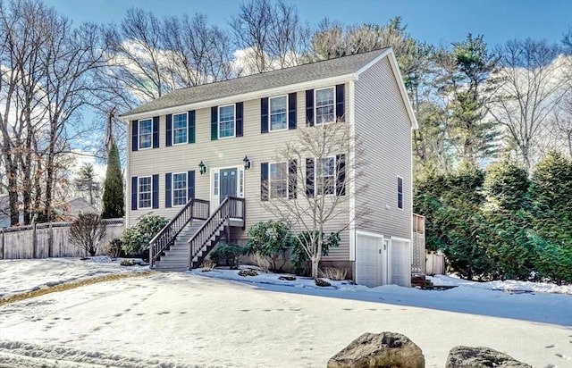 colonial inspired home with a garage