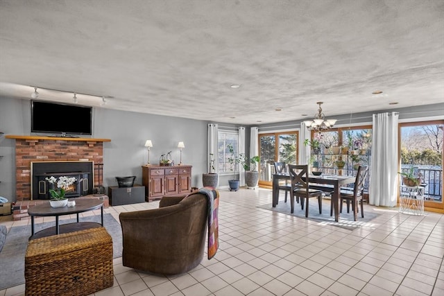 living room featuring light tile patterned floors, a fireplace, and a wealth of natural light