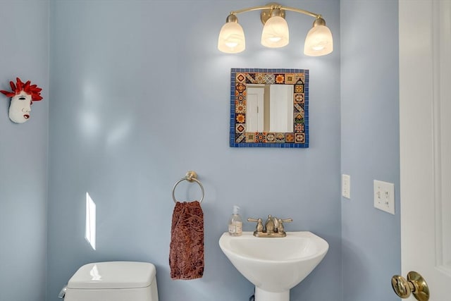 bathroom featuring toilet and sink