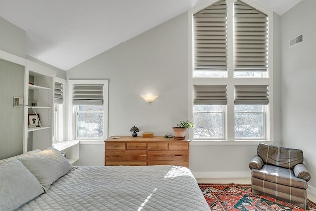 bedroom featuring lofted ceiling and carpet floors