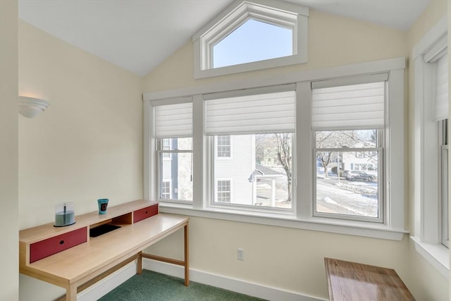 office with lofted ceiling, a healthy amount of sunlight, and carpet flooring