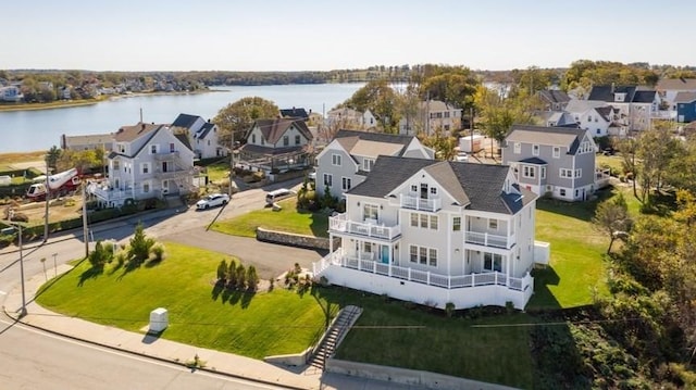 birds eye view of property with a water view