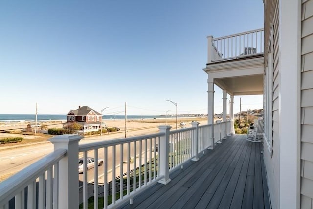 wooden deck featuring a water view