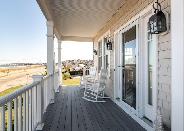 wooden terrace featuring a porch