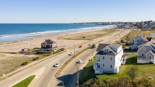 birds eye view of property featuring a water view and a view of the beach