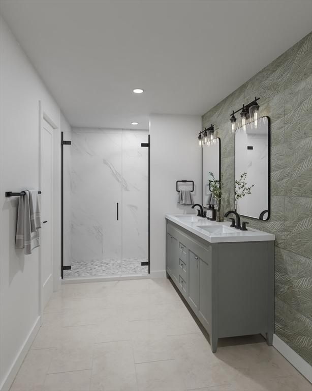 9 Sydney St Unit 2, Boston, MA 02125 - bathroom featuring a marble finish shower, double vanity, and recessed lighting