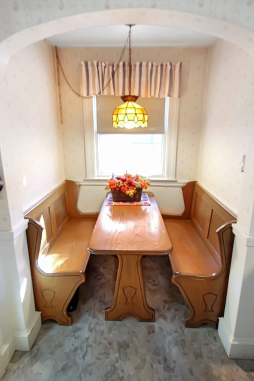 dining area featuring decorative columns