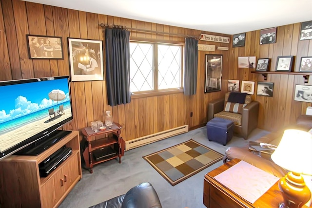 carpeted living room with wood walls and a baseboard heating unit