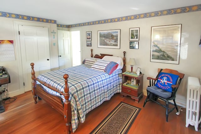 bedroom featuring wood-type flooring