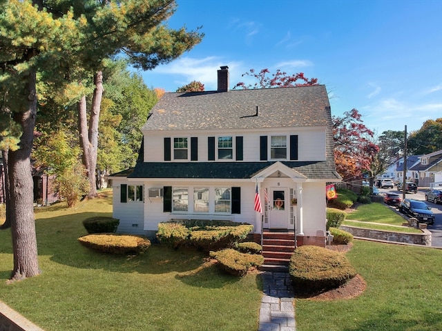 view of front of home with a front lawn