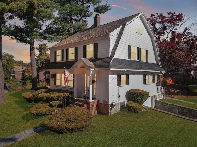 view of front of house with a lawn