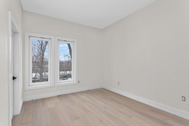 unfurnished room featuring light hardwood / wood-style floors