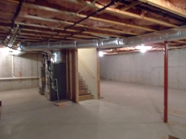 38 Stonebridge Dr Unit 38, Hanson, MA 02341 - unfinished below grade area with stairway, heating unit, and water heater