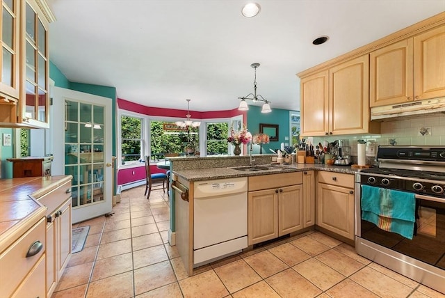 56 Bridle Path, Tisbury, MA 02567 - kitchen with stainless steel gas range oven, white dishwasher, under cabinet range hood, light brown cabinetry, and a sink