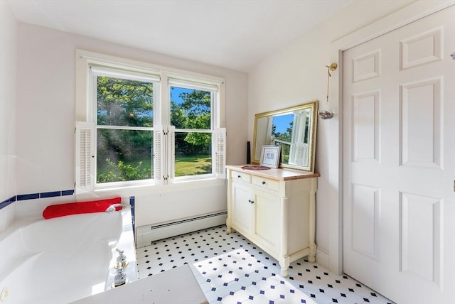 56 Bridle Path, Tisbury, MA 02567 - full bath featuring a baseboard radiator, a bath, vanity, and tile patterned floors