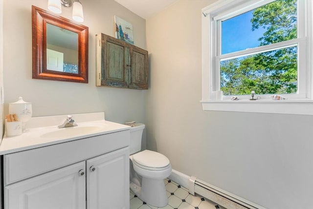 56 Bridle Path, Tisbury, MA 02567 - bathroom featuring vanity, a baseboard heating unit, toilet, and baseboards