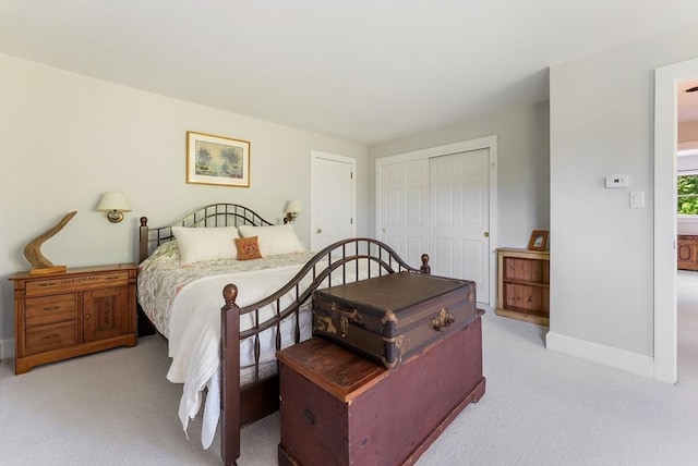 56 Bridle Path, Tisbury, MA 02567 - bedroom with light carpet, a closet, and baseboards